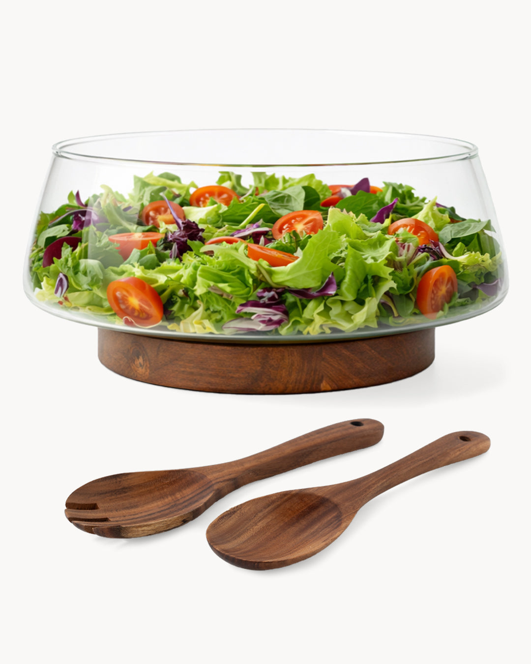 Salatschüssel aus Glas mit Salatbesteck und Untersetzer