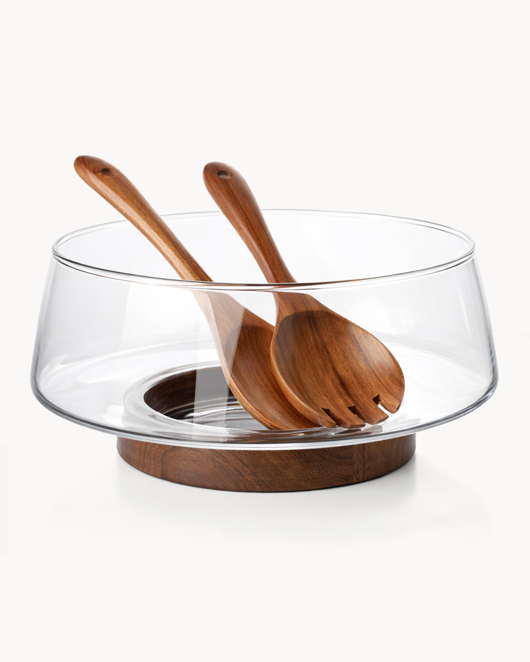 Salatschüssel aus Glas mit Salatbesteck und Untersetzer